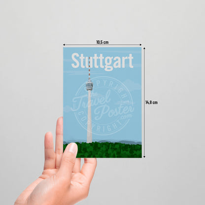 A hand holding a postcard of the Stuttgart TV Tower on a white background.