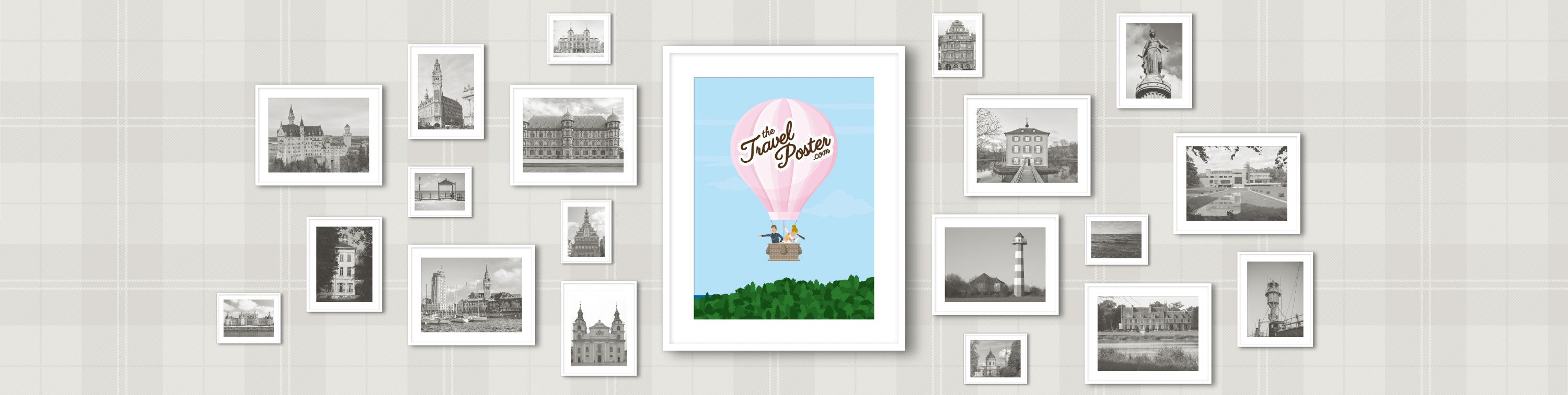 a frame with a pink hot air balloon travelling over a green forest